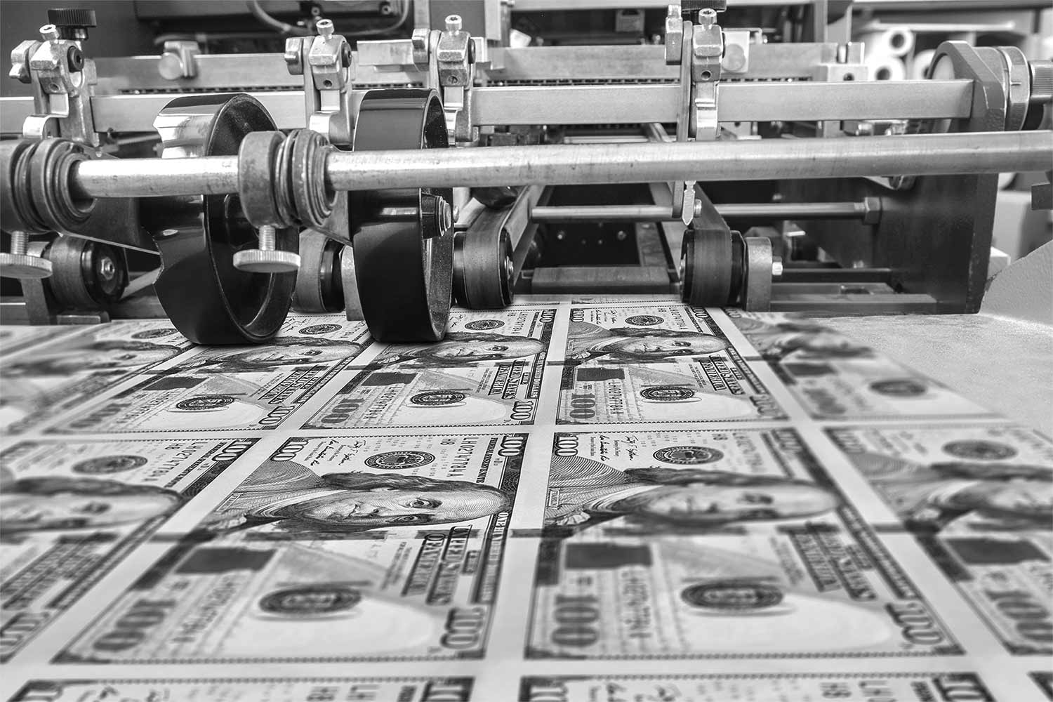 Money press, pressing $100 bills.