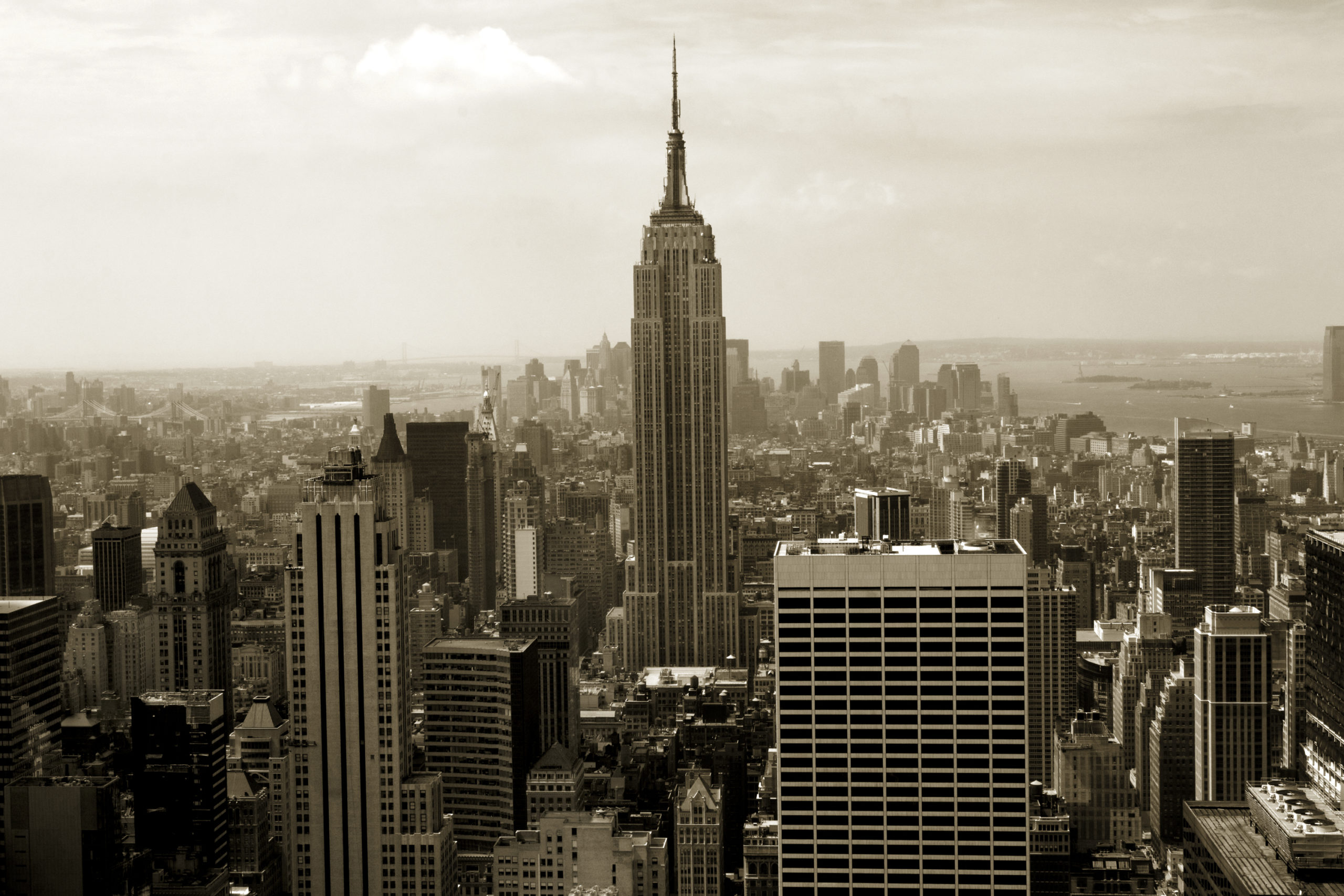 A shot of the Empire State building and the New York Skyline in sepia.